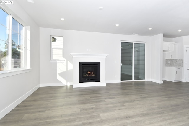 unfurnished living room featuring light hardwood / wood-style floors