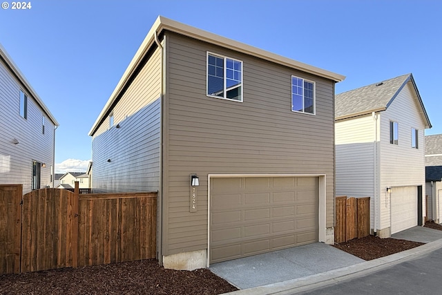 view of side of property with a garage