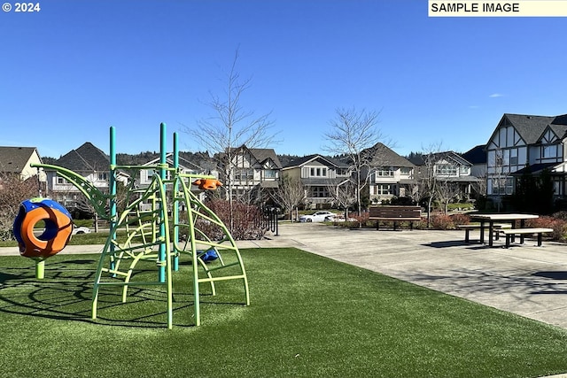 view of playground featuring a yard