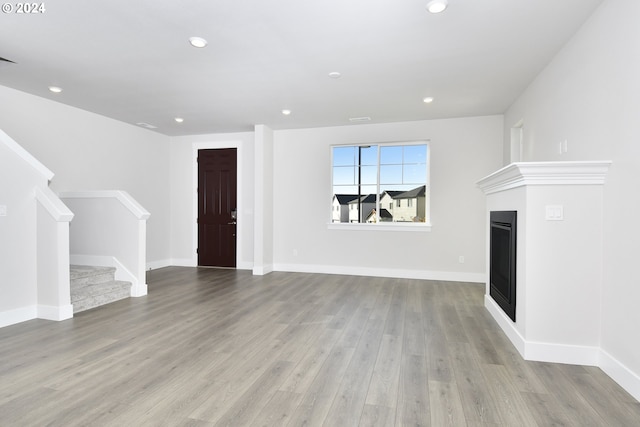 unfurnished living room featuring light wood-type flooring