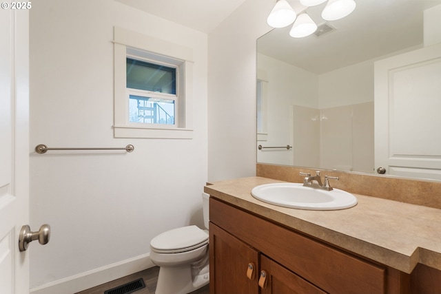 bathroom featuring a shower, wood-type flooring, toilet, and vanity