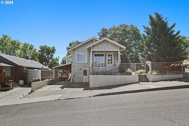 view of front of property with a carport