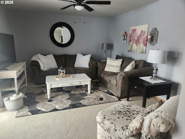 living room featuring carpet and ceiling fan