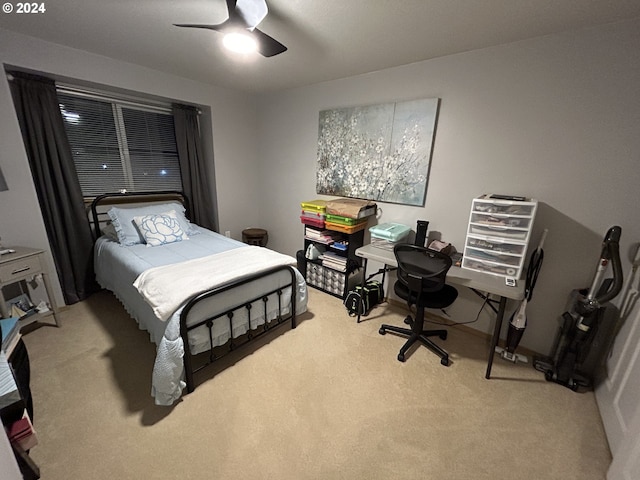 bedroom featuring ceiling fan and light colored carpet