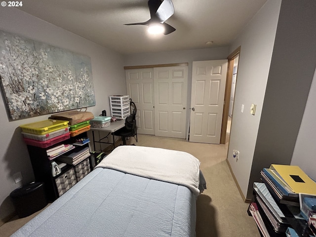 bedroom featuring carpet, a closet, and ceiling fan