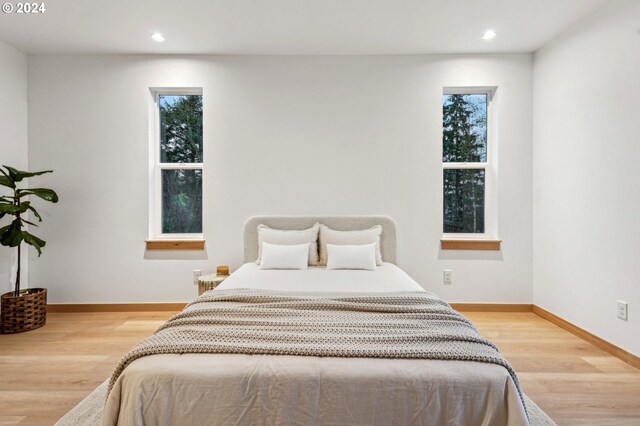 bedroom with light hardwood / wood-style flooring