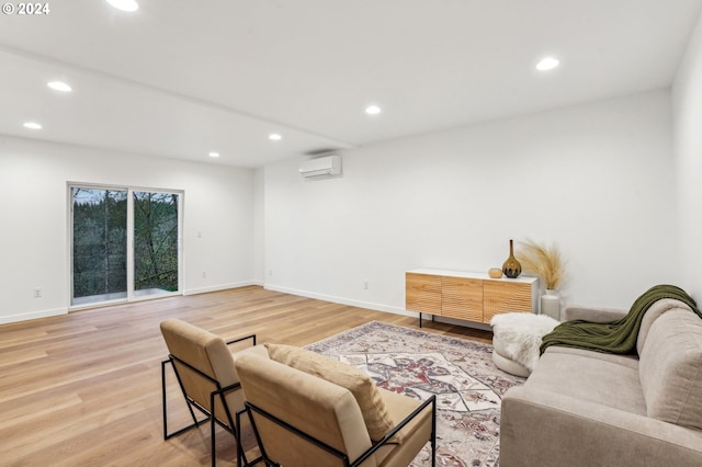 living room featuring hardwood / wood-style flooring and a wall unit AC