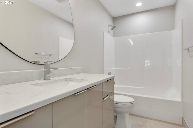 full bathroom featuring tile patterned floors, vanity, tub / shower combination, and toilet