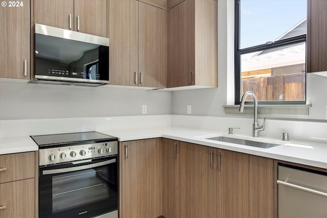 kitchen with appliances with stainless steel finishes and sink