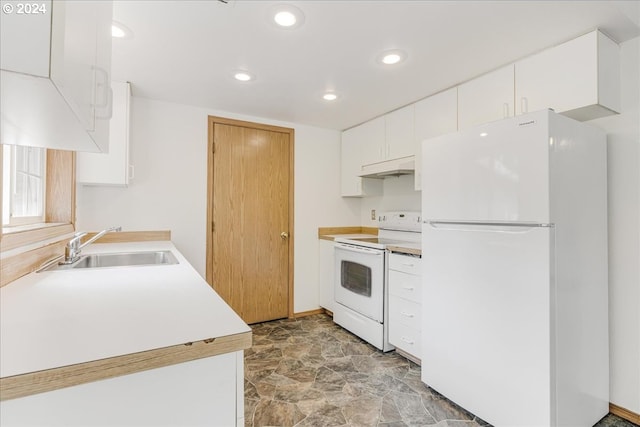 kitchen with sink, white appliances, and white cabinets