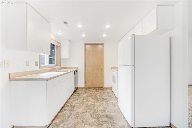 kitchen with white cabinets, white appliances, and sink