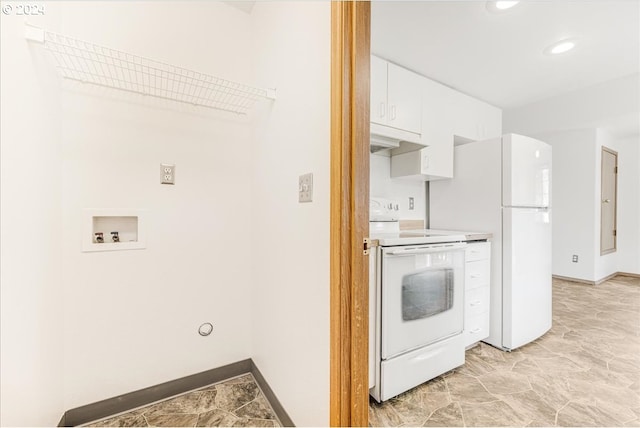 kitchen featuring white cabinets and white appliances