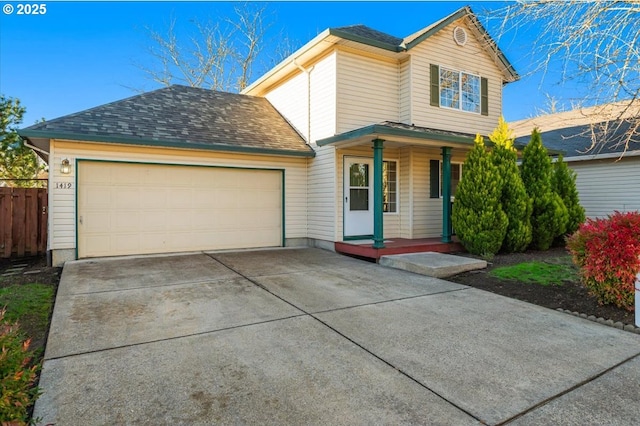 front of property with covered porch and a garage