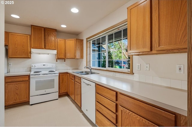 kitchen featuring sink and white appliances