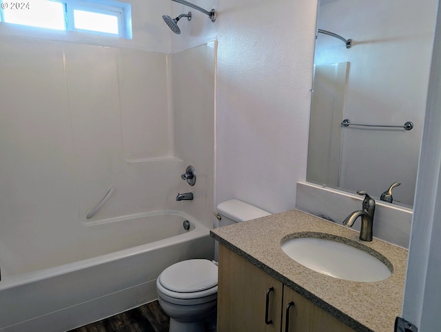 full bathroom with vanity, toilet, shower / tub combination, and hardwood / wood-style flooring