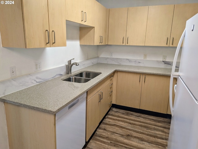 kitchen with white appliances, light brown cabinetry, sink, and dark hardwood / wood-style floors