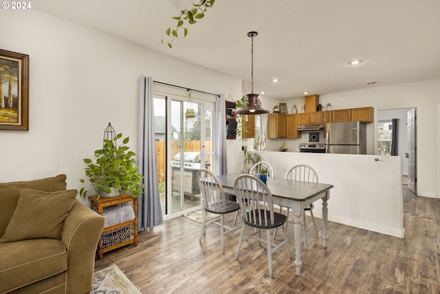 dining space featuring light wood-type flooring