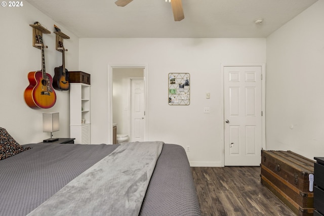 bedroom with ensuite bath, ceiling fan, and dark hardwood / wood-style floors