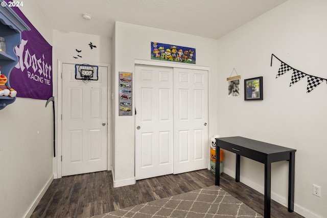 entryway with dark hardwood / wood-style floors