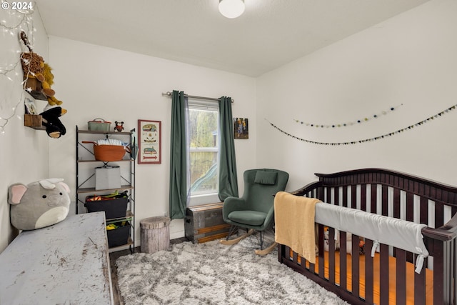 bedroom featuring a crib