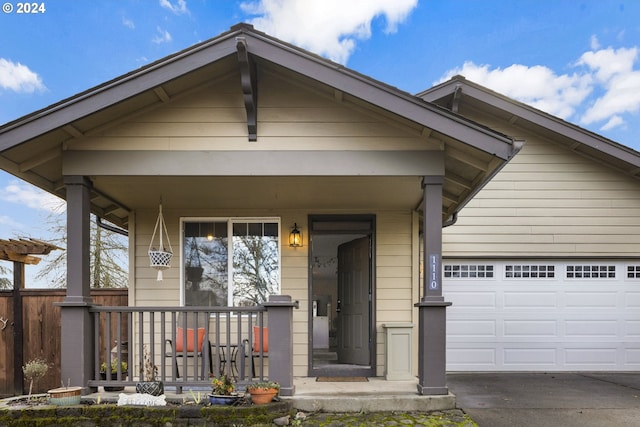 view of front of house with a porch and a garage