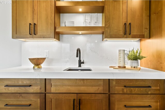 kitchen featuring backsplash and sink