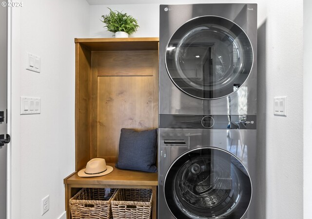 laundry area featuring stacked washing maching and dryer