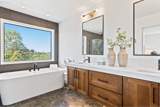 bathroom featuring a bathtub and vanity