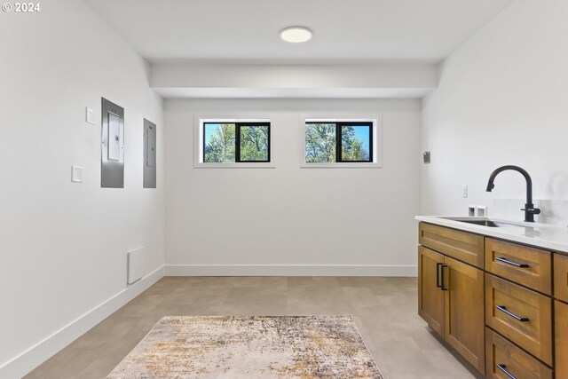 bathroom with electric panel and sink