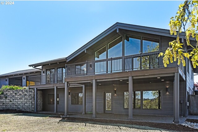 rear view of house featuring a balcony