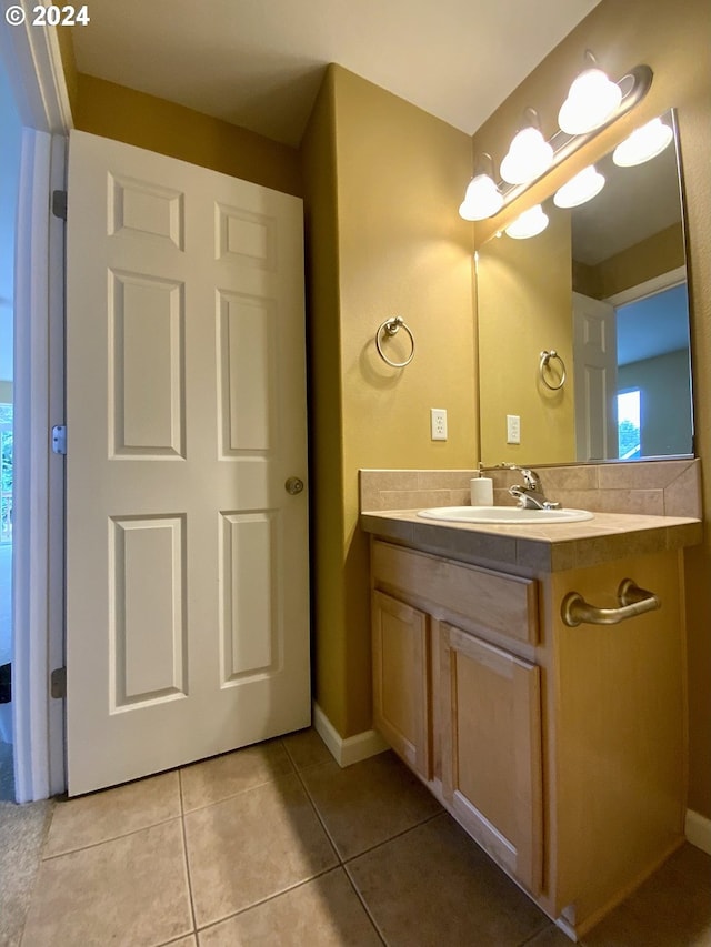 bathroom featuring tile patterned floors and vanity