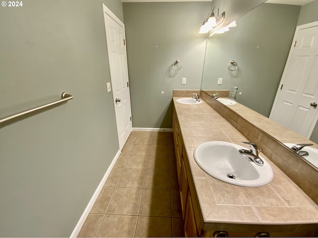 bathroom with tile patterned floors and vanity