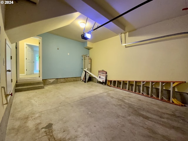 garage featuring a garage door opener and electric water heater