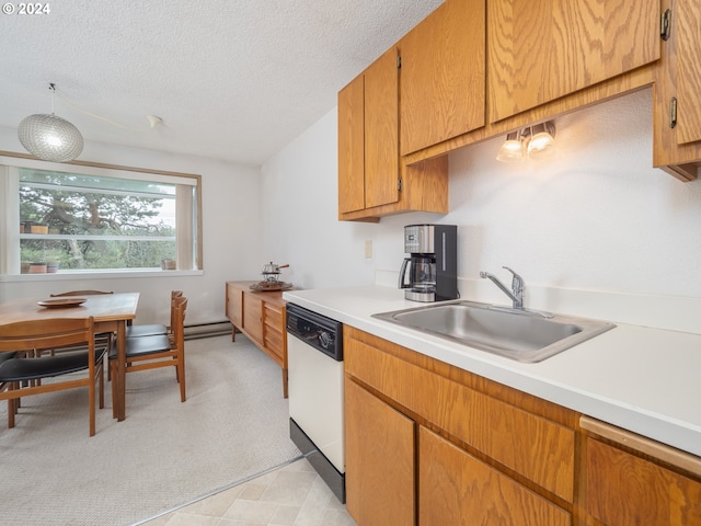 kitchen featuring sink, white dishwasher, and a textured ceiling