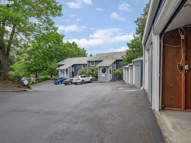 view of car parking with a garage