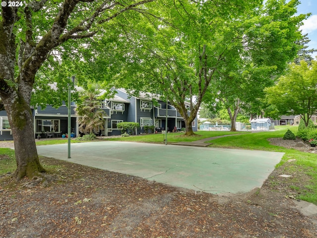 view of yard with basketball court