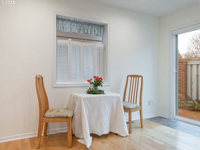 dining area with light hardwood / wood-style floors