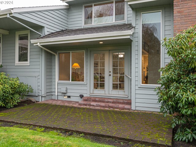 view of exterior entry featuring french doors