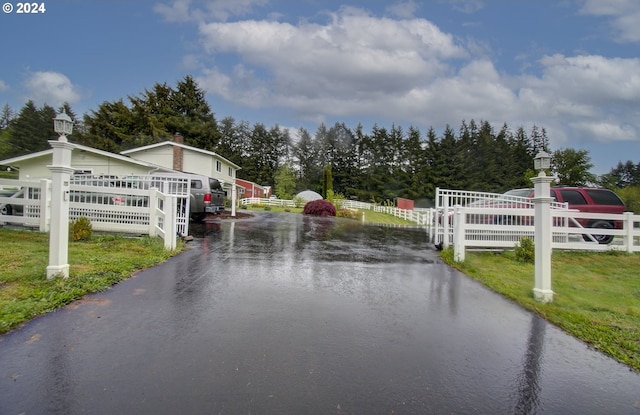 exterior space featuring fence and a lawn