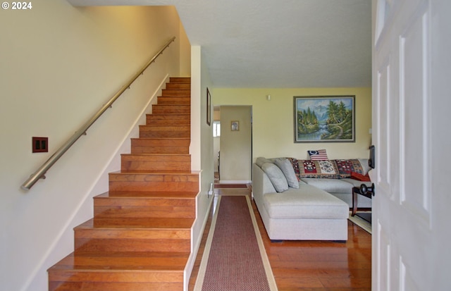 stairway with wood finished floors