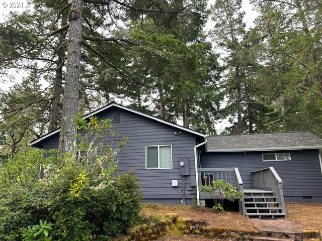 rear view of house with a deck