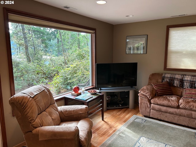 living room with light hardwood / wood-style floors