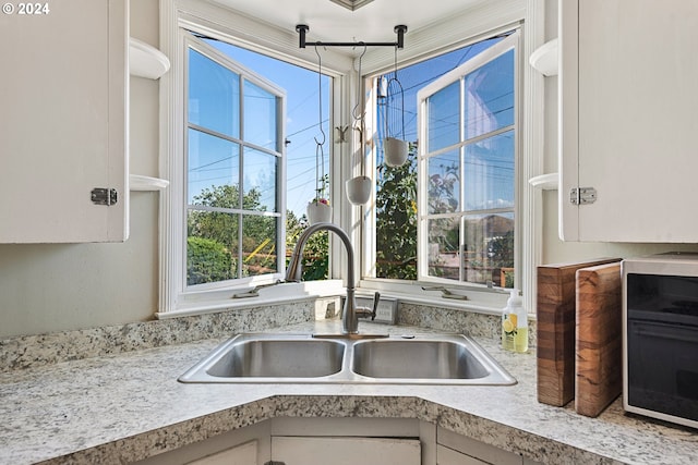 kitchen with hanging light fixtures and sink