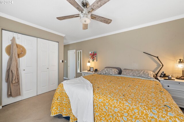 bedroom with a closet, ceiling fan, light carpet, and ornamental molding