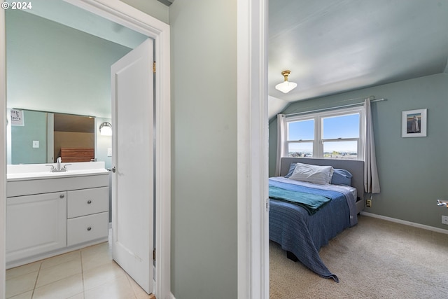 carpeted bedroom featuring lofted ceiling