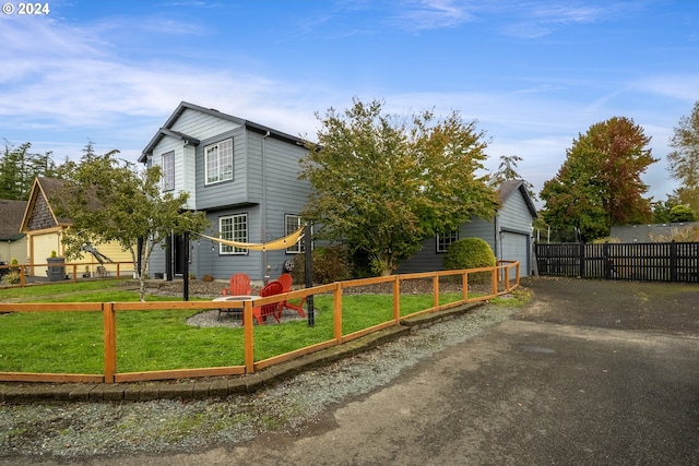 view of property exterior featuring an outdoor structure, a yard, and a garage