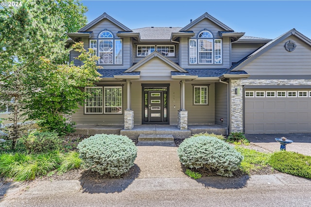 view of front of house with a garage and covered porch