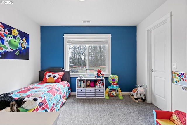 bedroom with baseboards, visible vents, and carpet flooring