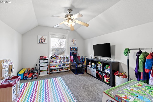 rec room featuring vaulted ceiling, carpet floors, a textured ceiling, and ceiling fan