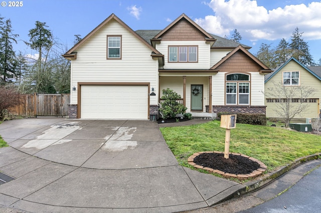 craftsman house featuring brick siding, concrete driveway, an attached garage, fence, and a front lawn